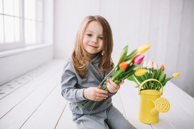 Mothers day concept with happy daughter and flowers