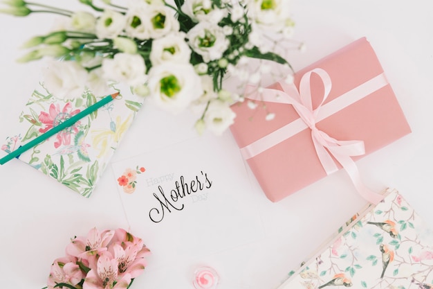 Mothers inscription with flowers and gift box