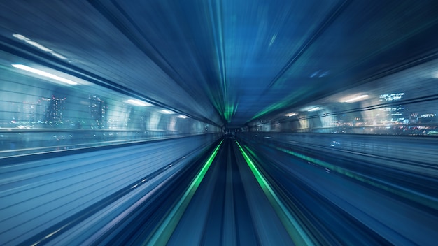 Free photo motion blur of automatic train moving inside tunnel in tokyo, japan.