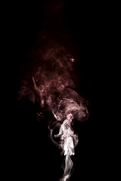 Free photo motion white rising smoke over the black background