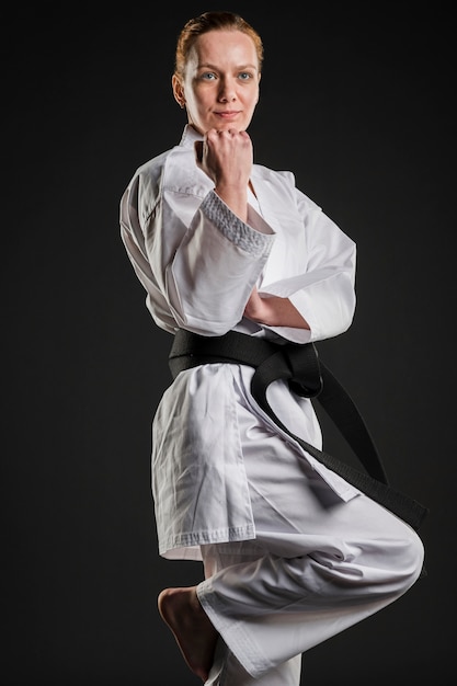 Free photo motivated karate fighter posing medium shot