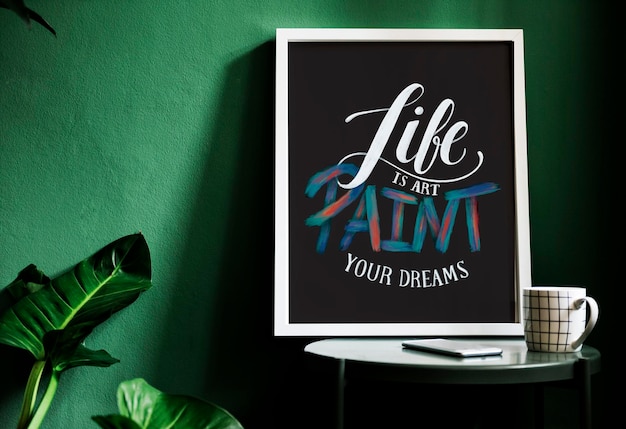 Free Photo a motivation typography print on the desk against the green wall