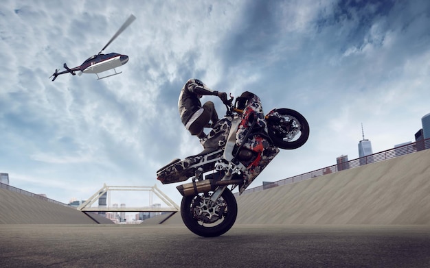 Moto rider making a stunt on his motorbike Biker doing a difficult and dangerous stunt