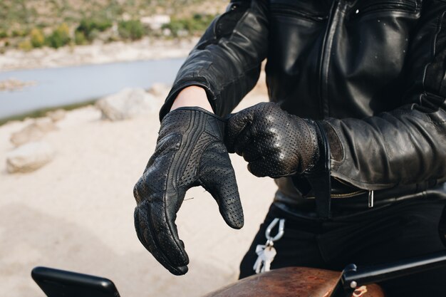 Motorcycle driver wears leather gloves