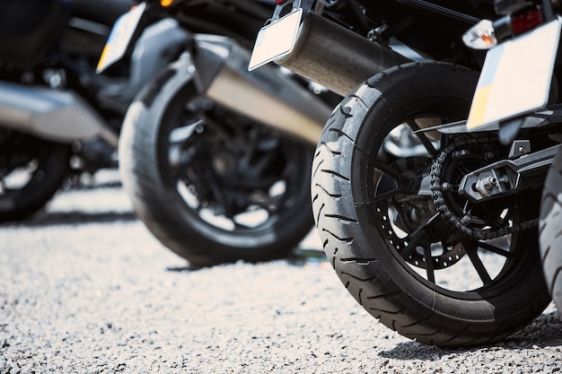 Motorcycle luxury items close-up: headlights, shock absorber, wheel, wing, toning.