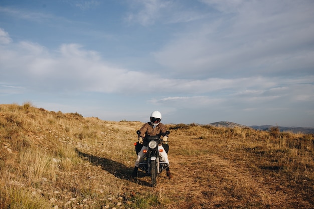 Motorcycle rider on offroad gravel track