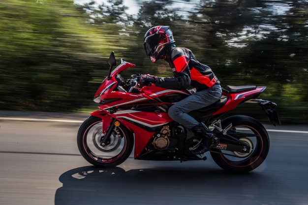 A motorcyclist biking on the road.