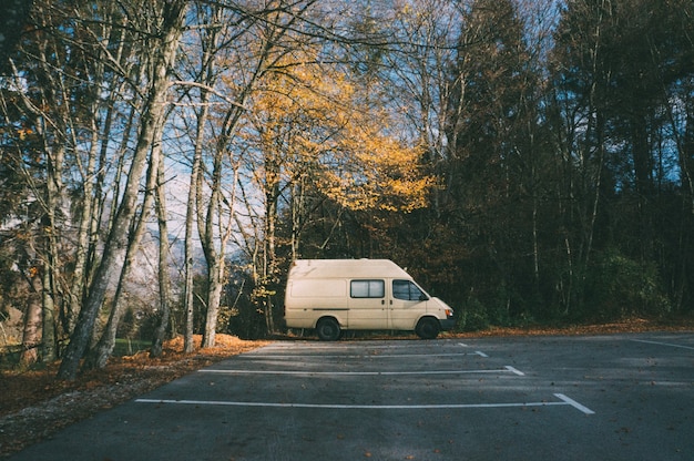 Free Photo motorhome parked in the parking lot in the forest. camping and adventure concept