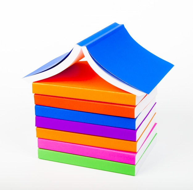 Free photo mountain of books with white background