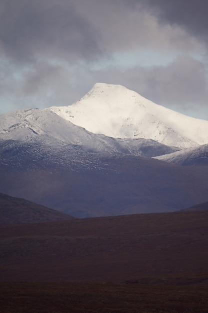 mountain under the gloomy cloudy sky in the Gates of the Arctic National Park