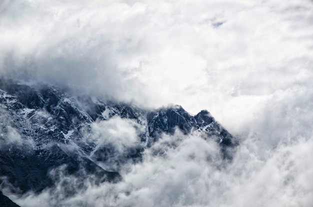 mountain landscape with fog and cloudy sky