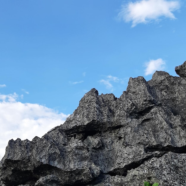 Free photo mountain peak with blue sky