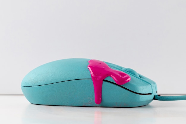 Free Photo mouse with dripping pink paint