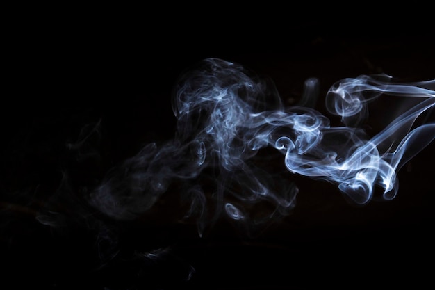 Free photo movement of white smoke on black background for art design