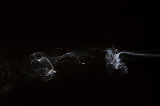 Free Photo movement of white smoke on black background