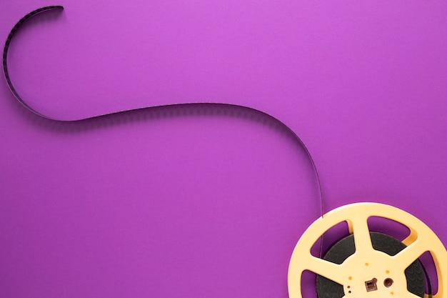 Free photo movie reel on purple background