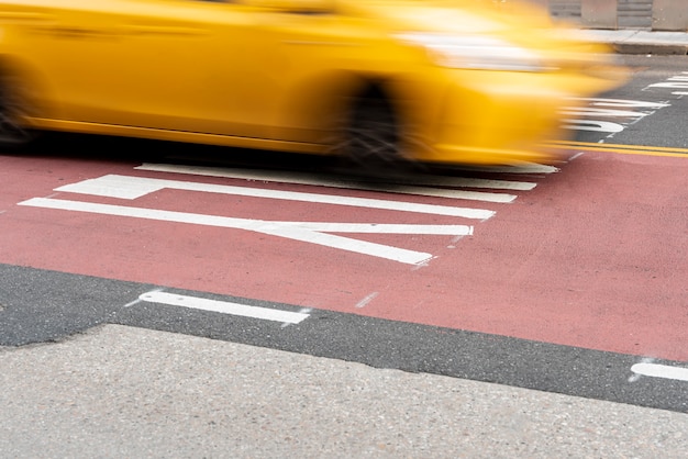 Free photo moving yellow car in the city