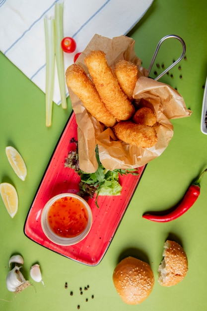 Mozzarella sticks served with sweet chili sauce