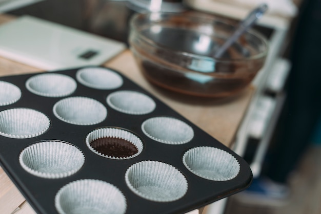 Free Photo muffin tin near batter