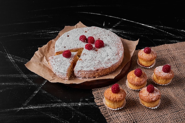 Muffins with lemon pie on wooden platter .