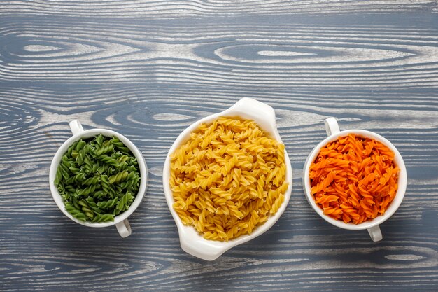 Multi-colored gluten free vegetable fusilli pasta.