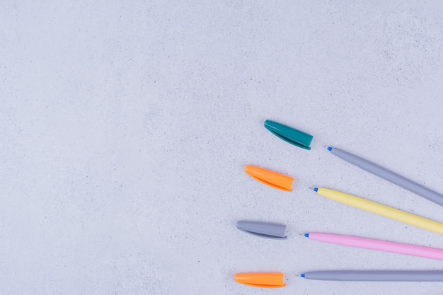 Multicolor mandala craft pencils isolated on grey surface