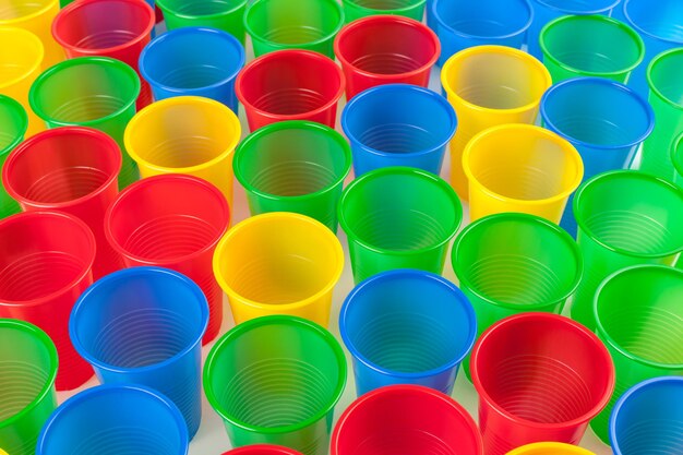 Multicolor plastic glasses isolated on white background