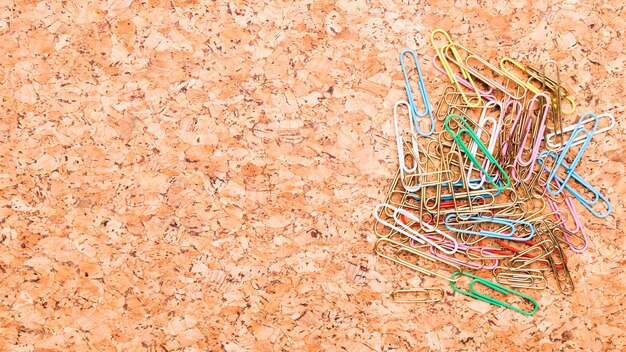 Multicolored paper clips placed on desk