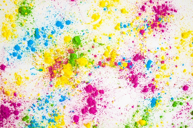 Free photo multicolored powder splatter on white background