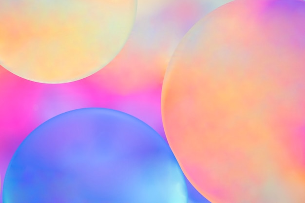 Multicolored spheres on hued blurred background