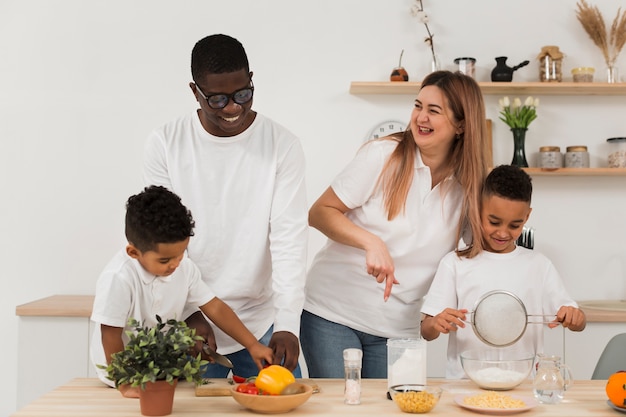 Multicultural family cooking in the kitchen together