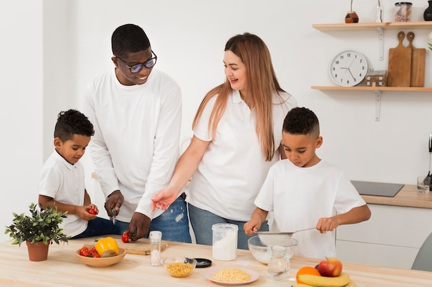 Free photo multicultural family cooking together