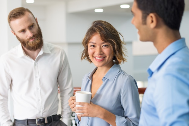 Free photo multiethnic business group chatting during corporate meeting