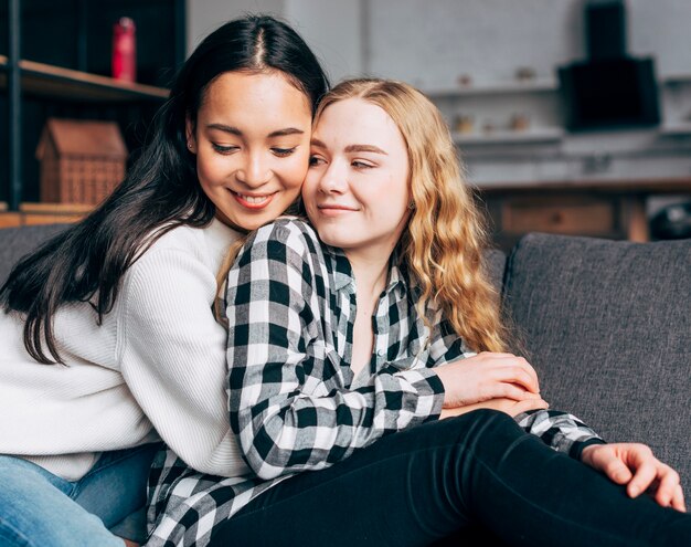 Multiethnic female friends embracing