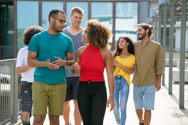 Multiethnic group of people in casual walking in urban settings