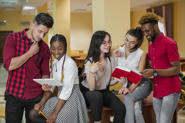 Free photo multiethnic students studying in library