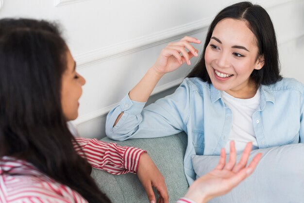 Multiethnic women chatting at home