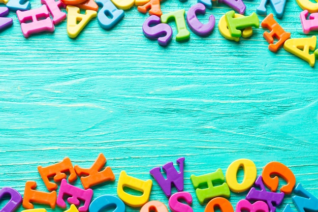 Multiple colored letters on wooden table