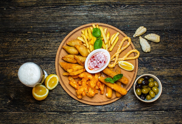 Multiple fried snacks with sweet chili sauce