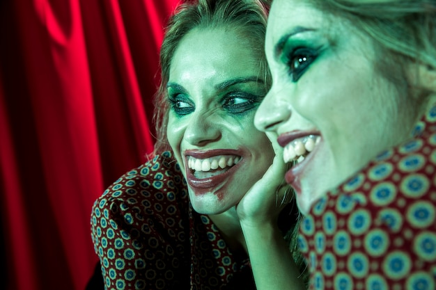 Free Photo multiple mirror effect of woman smiling as joker