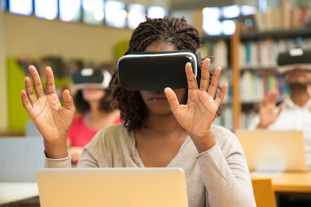 Free Photo multiracial group of students using vr gadgets during class