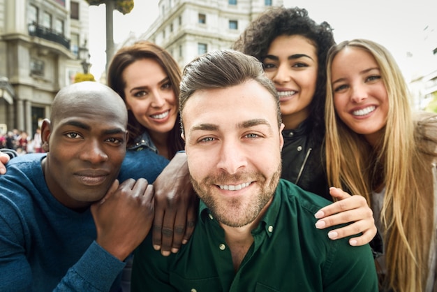 Multiracial group of young people taking selfie