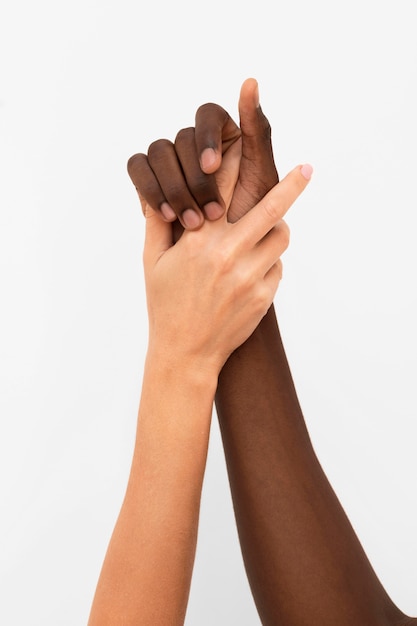 Multiracial hands coming together