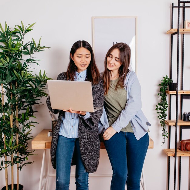 Multiracial women with notebook