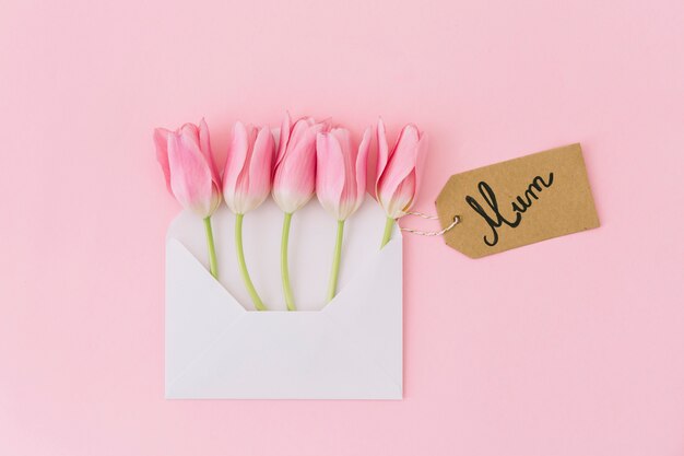 Mum inscription with tulips in envelope