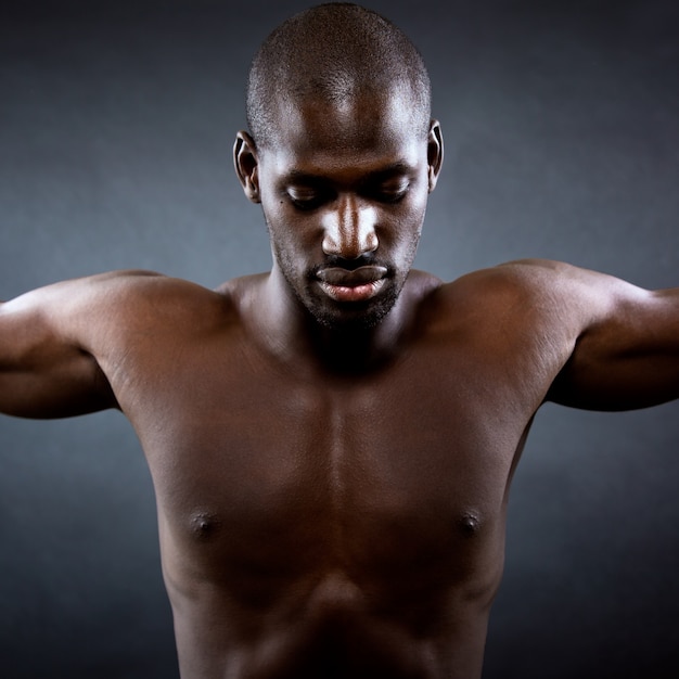 Free Photo muscular man with his arms outstretched. freedom concept.