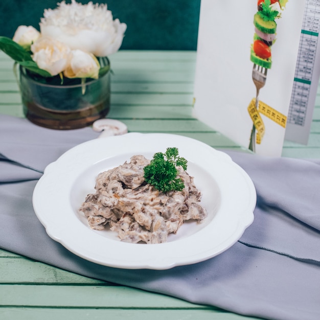 Free Photo mushroom sauteed with meat and green herbs.