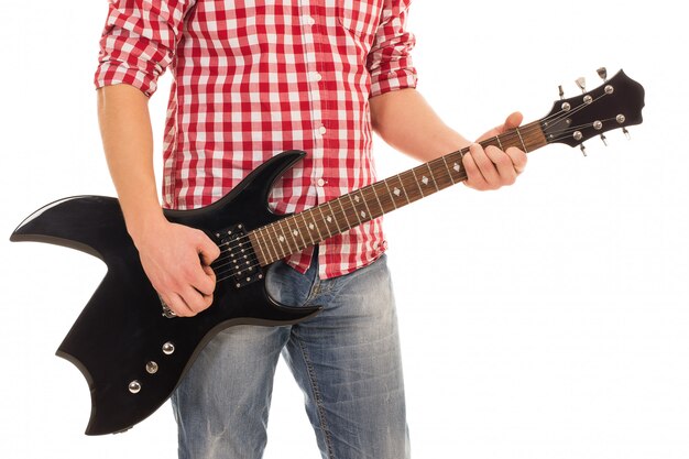 Music, close-up. Musician holding electro guitar