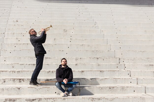 Musician friends in a stadium