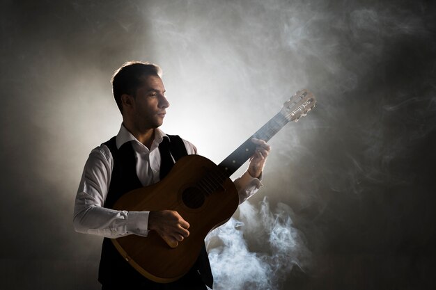 Musician on stage playing the guitar